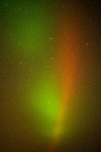 red and green northern lights in night sky