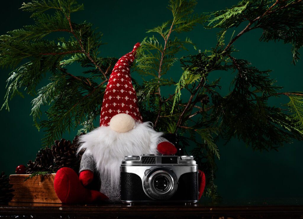 small gnome with hand on camera