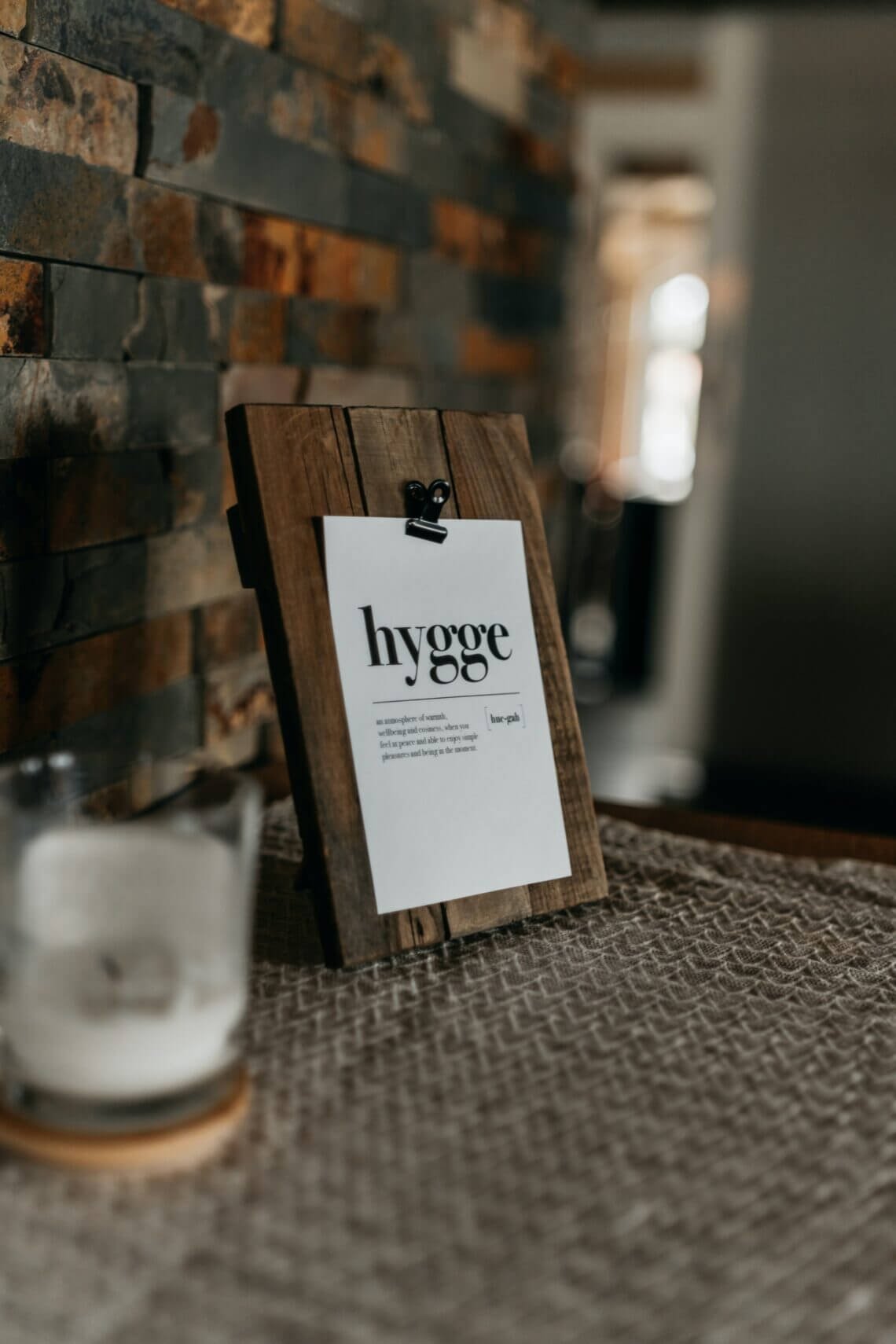 The Secret behind the Hygge Meaning Sign on counter showing the hygge meaning in black and white