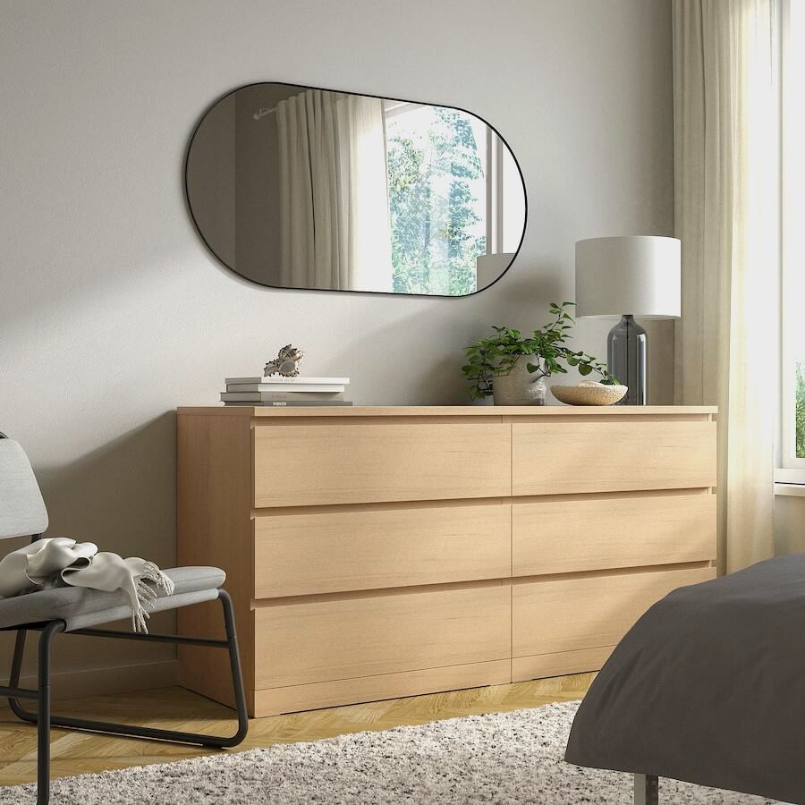 dresser with lamp on top