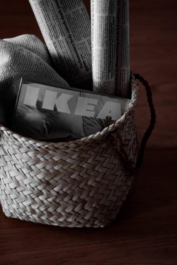 IKEA magazine in a wooden basket